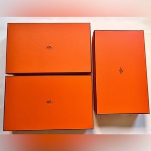 Hermes empty boxes with ribbons and tissues.